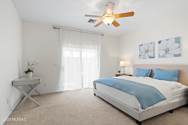 bedroom with carpet flooring, a ceiling fan, and visible vents