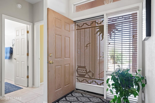 foyer entrance with light tile patterned floors