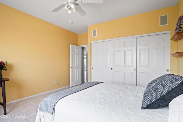 bedroom featuring light tile patterned flooring, baseboards, a closet, and visible vents