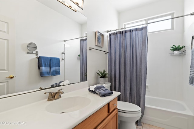 bathroom with toilet, vanity, tile patterned flooring, and shower / tub combo with curtain