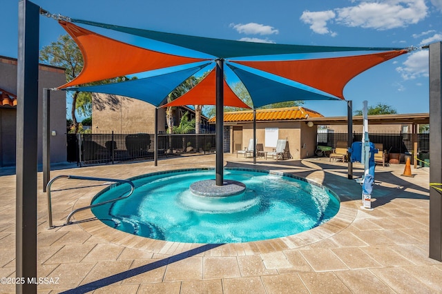 view of swimming pool featuring fence, a patio area, and a fenced in pool