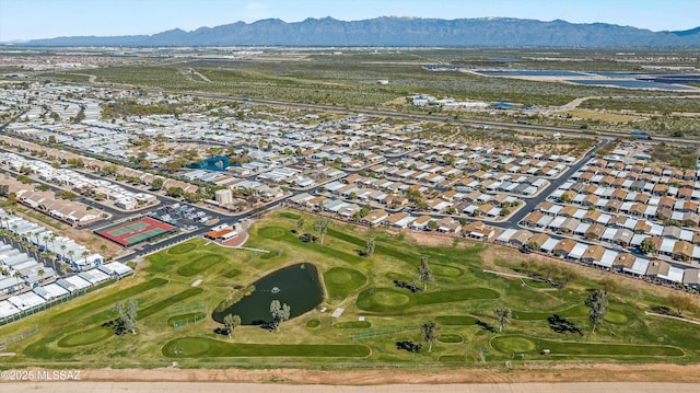 aerial view featuring view of golf course, a residential view, and a mountain view