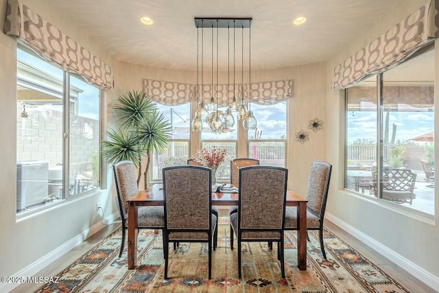 dining area with recessed lighting and baseboards