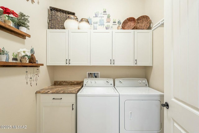 laundry room with washing machine and dryer and cabinet space