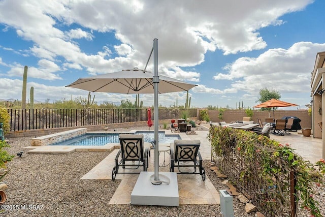 view of patio / terrace with a fenced backyard and a fenced in pool