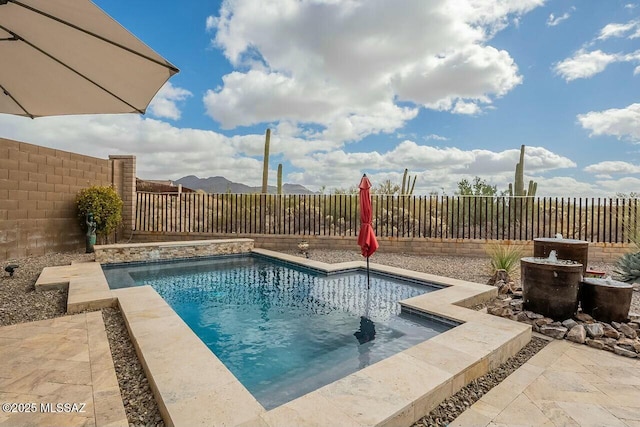 view of pool featuring a fenced backyard and a fenced in pool