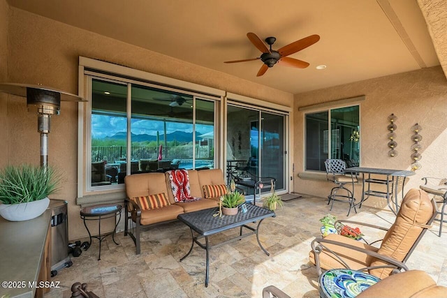 view of patio / terrace featuring ceiling fan