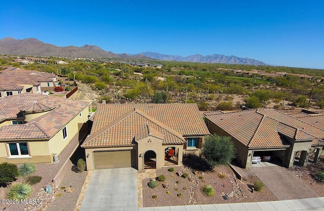 birds eye view of property featuring a mountain view