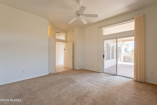 spare room with light carpet, baseboards, and a ceiling fan