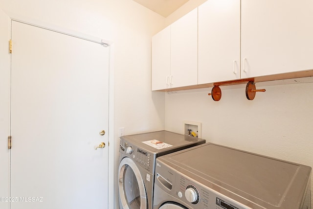 laundry area with cabinet space and washing machine and clothes dryer