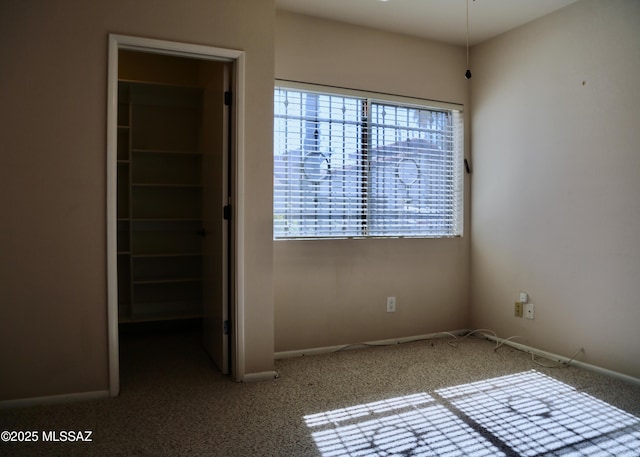 unfurnished bedroom featuring baseboards