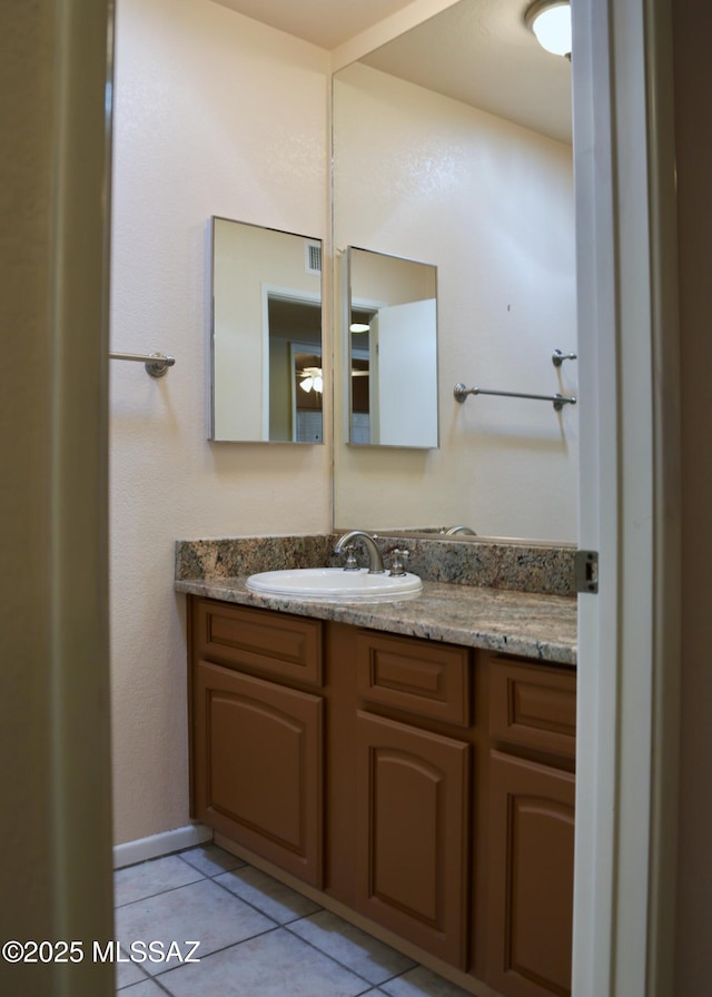 bathroom featuring tile patterned floors, visible vents, and vanity