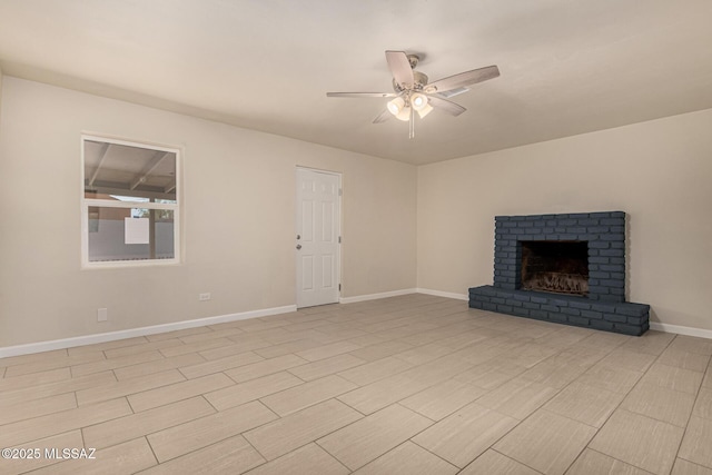 4510 E 6th St, Tucson, AZ 85711 - unfurnished living room with a ceiling fan, baseboards, and a fireplace