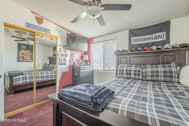 carpeted bedroom featuring a ceiling fan, a closet, and a textured ceiling