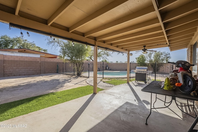 view of patio / terrace featuring a fenced backyard, a fenced in pool, and area for grilling