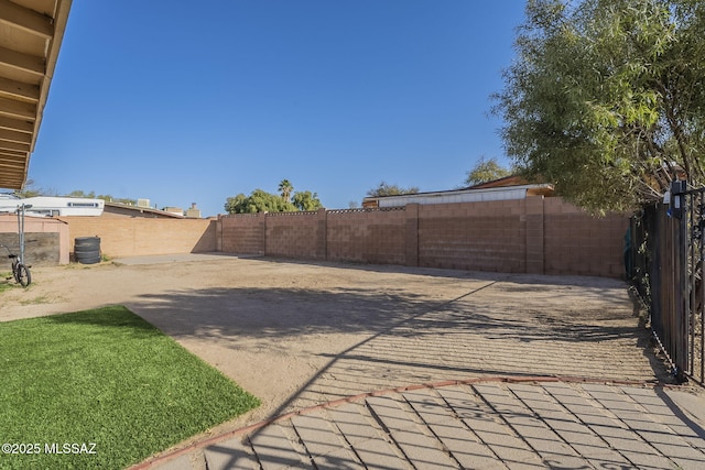 view of patio featuring fence