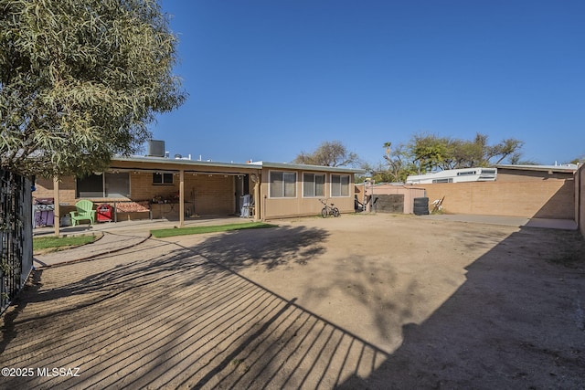 back of property featuring a patio area, fence, and cooling unit