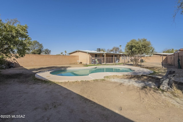 view of pool with a patio area, a fenced backyard, and a fenced in pool