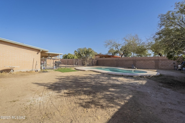 view of yard with a fenced in pool and a fenced backyard