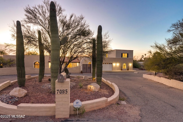 pueblo-style house with stucco siding