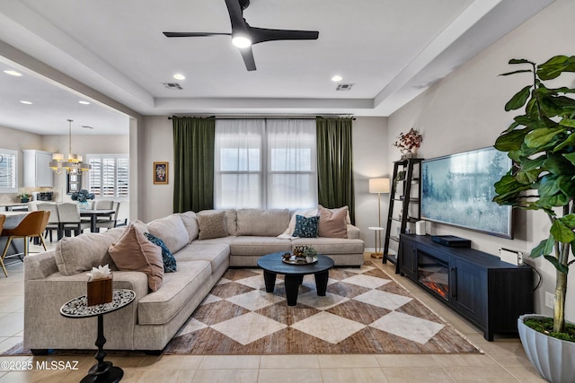 living area featuring light tile patterned floors and visible vents