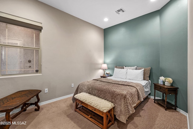 carpeted bedroom with baseboards, visible vents, and recessed lighting