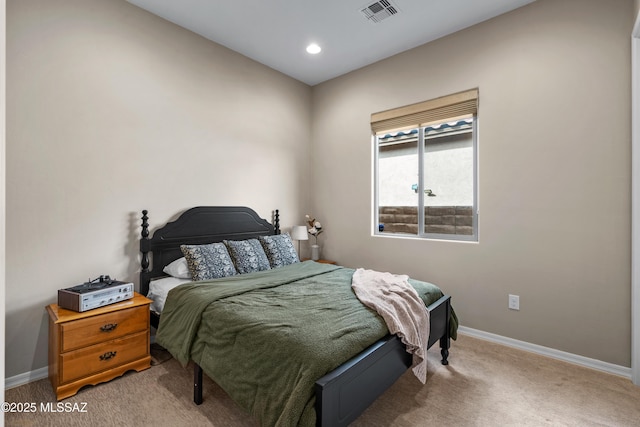 carpeted bedroom with recessed lighting, visible vents, and baseboards