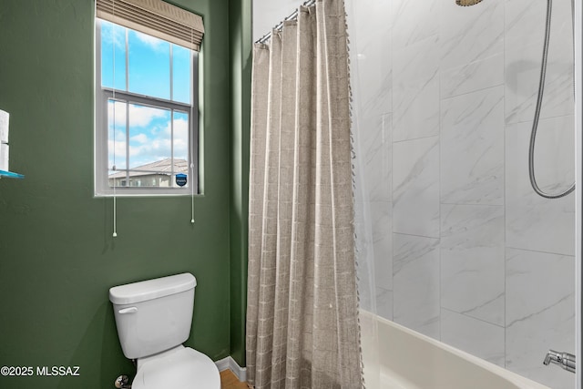 bathroom featuring shower / bathtub combination with curtain and toilet