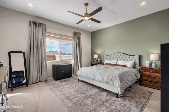 bedroom with a ceiling fan, recessed lighting, and light carpet