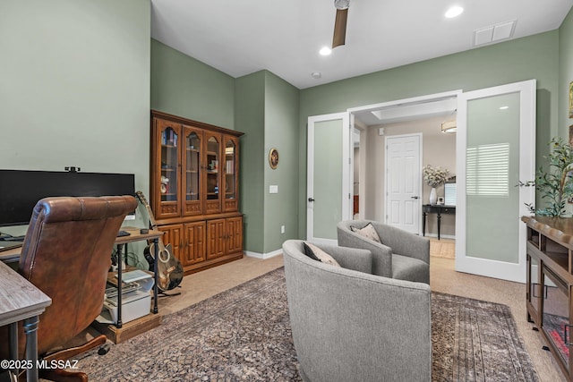 office space with carpet, recessed lighting, visible vents, a ceiling fan, and baseboards