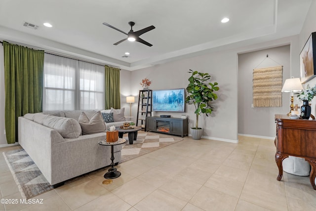 tiled living area featuring baseboards, visible vents, a ceiling fan, and recessed lighting