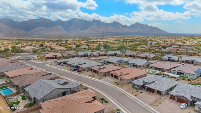 aerial view with a mountain view and a residential view