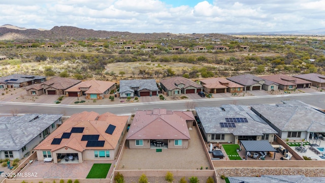 birds eye view of property with a mountain view and a residential view