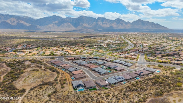 birds eye view of property featuring a mountain view