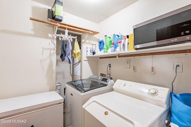 laundry room with washing machine and dryer