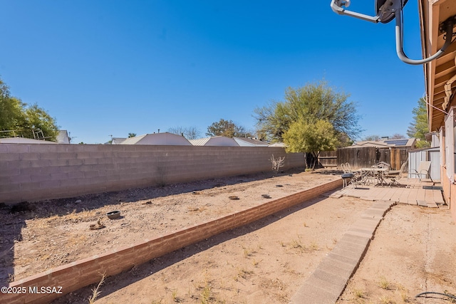 view of yard with a patio area and a fenced backyard