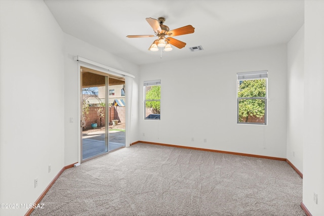 unfurnished bedroom featuring access to exterior, carpet flooring, visible vents, and baseboards