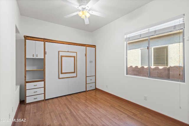 unfurnished bedroom featuring wood finished floors and ceiling fan