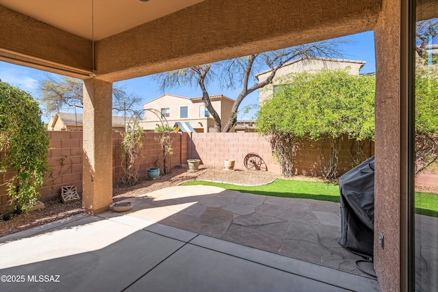 view of patio with a fenced backyard