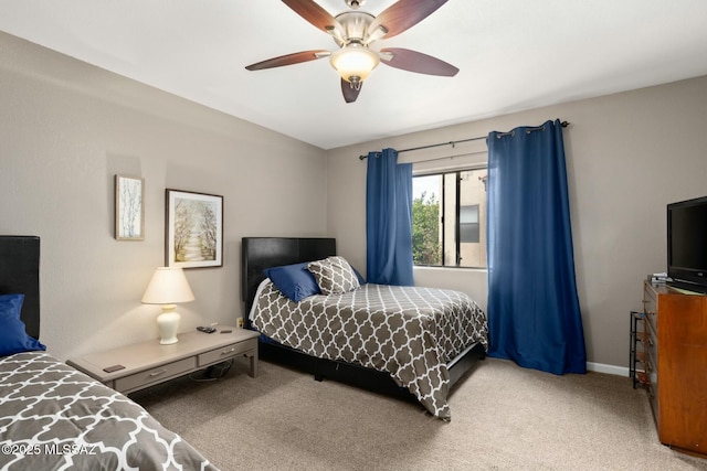 bedroom with carpet flooring, baseboards, and ceiling fan