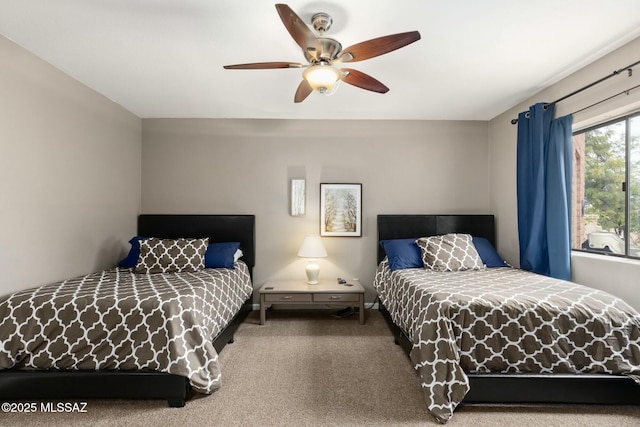 carpeted bedroom with a ceiling fan