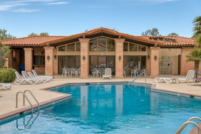 pool with a patio