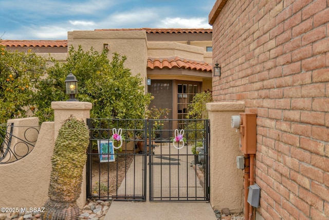 view of gate with fence