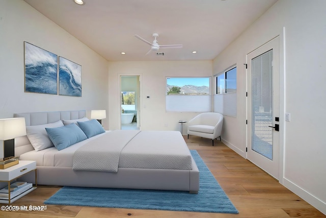 bedroom with recessed lighting, visible vents, baseboards, and wood finished floors