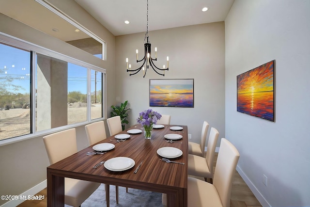 dining room featuring recessed lighting, baseboards, and an inviting chandelier