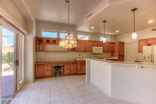 13755 N Buster Spring Way, Oro Valley, AZ 85755 - kitchen featuring white appliances, plenty of natural light, recessed lighting, hanging light fixtures, and brown cabinetry