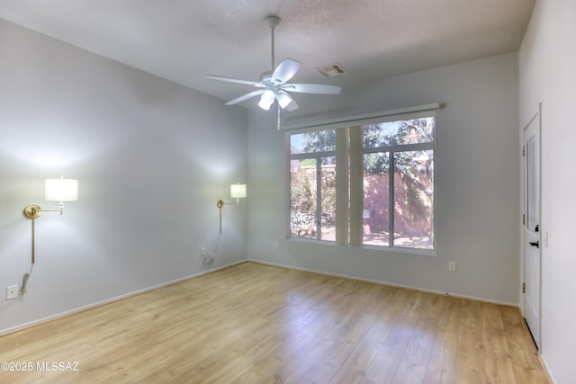 13755 N Buster Spring Way, Oro Valley, AZ 85755 - unfurnished room featuring wood finished floors and ceiling fan