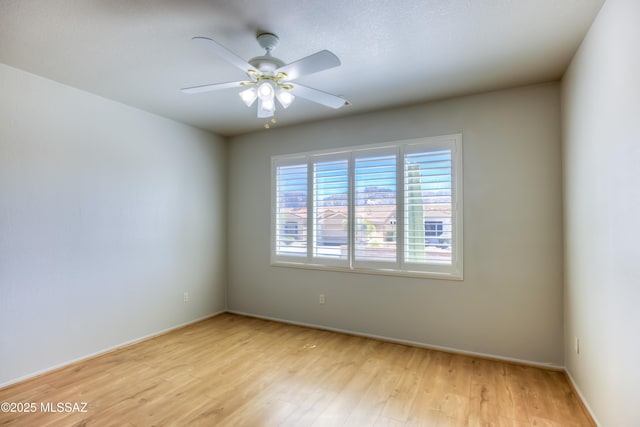 13755 N Buster Spring Way, Oro Valley, AZ 85755 - empty room with light wood-style floors and a ceiling fan
