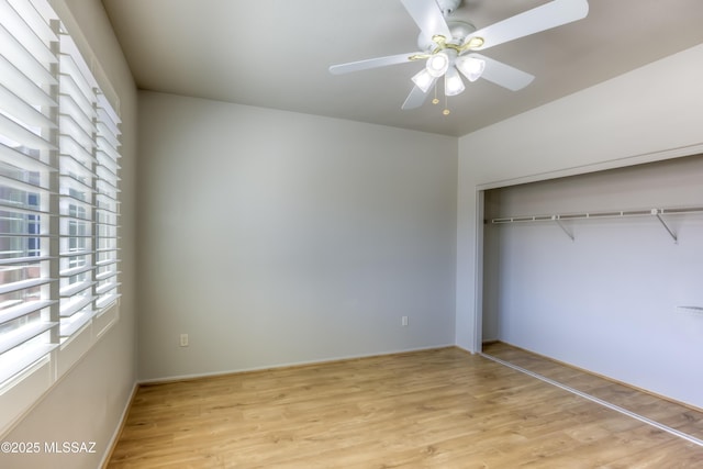 13755 N Buster Spring Way, Oro Valley, AZ 85755 - unfurnished bedroom featuring light wood finished floors, a closet, and a ceiling fan