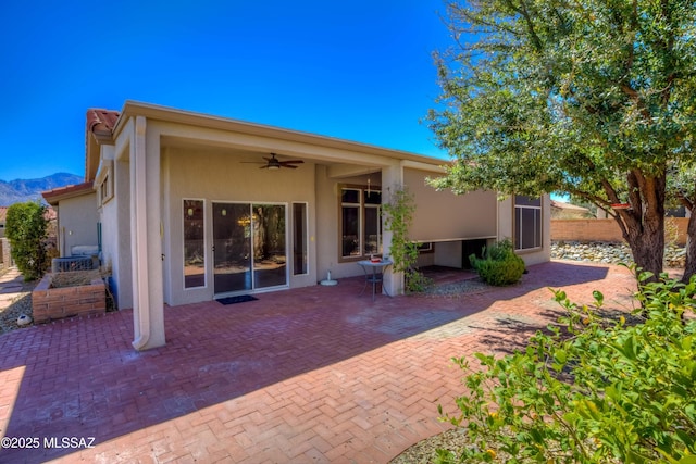 13755 N Buster Spring Way, Oro Valley, AZ 85755 - back of property featuring stucco siding, a patio, a ceiling fan, and a mountain view